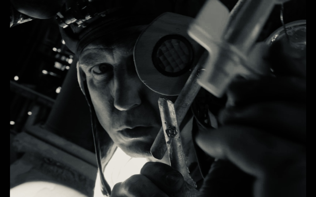Lars Eidinger stares intently into the camera