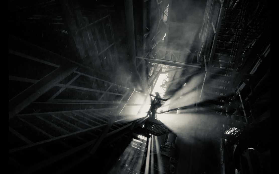 A man walks through the light-filled Völklinger Hütte.
